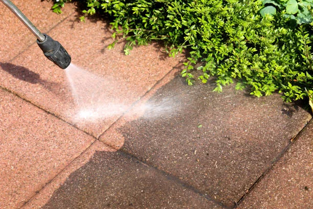 power washing a patio for a clean finish